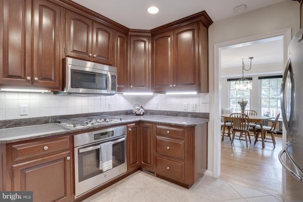 Chandelier, Dining room, Interior, Kitchen, Recessed Lighting, Stainless Steel Appliances, Wood Texture Flooring
