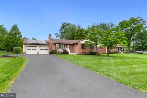 Attached, Backyard, Exterior, Facade, Brick Facade, Solar Panels, Ranch