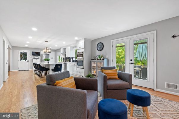Chandelier, Dining room, Interior, Kitchen, Living room, Pendant Lights, Recessed Lighting, Stainless Steel Appliances, Wood Texture Flooring