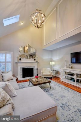 Chandelier, Fireplace, Interior, Living room, Pendant Lights, Recessed Lighting, Wood Texture Flooring
