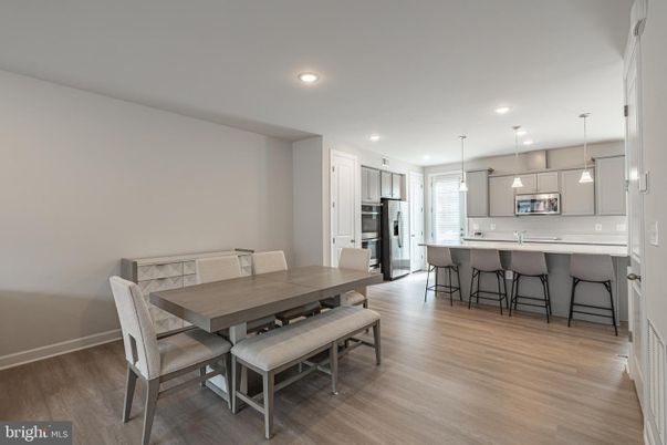 Dining room, Interior, Kitchen, Pendant Lights, Recessed Lighting, Stainless Steel Appliances, Wood Texture Flooring