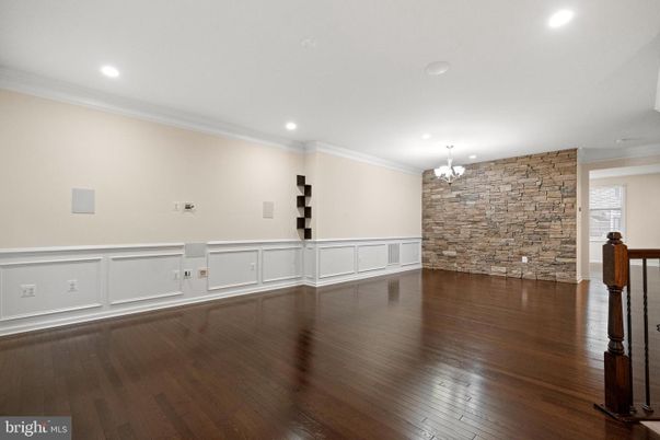 Chandelier, Empty room, Interior, Recessed Lighting, Stone Walls, Wood Texture Flooring