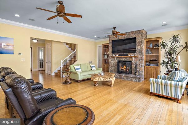 Fireplace, Interior, Living room, Recessed Lighting, Stone Walls, Wood Texture Flooring