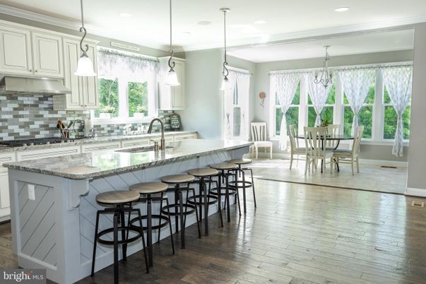Chandelier, Dining room, Interior, Kitchen, Pendant Lights, Recessed Lighting, Stainless Steel Appliances, Wood Texture Flooring
