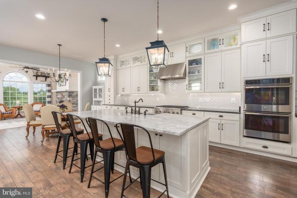 Chandelier, Dining room, Interior, Kitchen, Pendant Lights, Recessed Lighting, Stainless Steel Appliances, Wood Texture Flooring