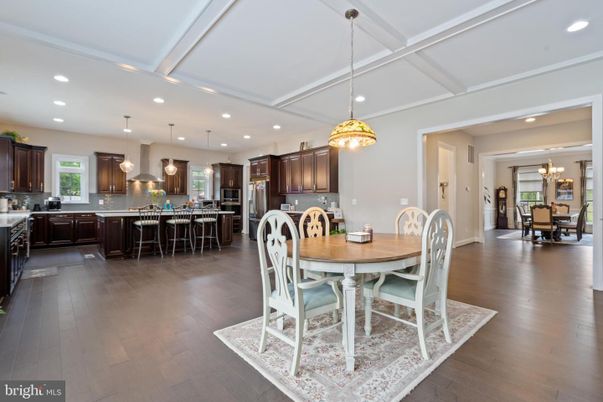 Chandelier, Dining room, Interior, Kitchen, Pendant Lights, Recessed Lighting, Stainless Steel Appliances, Wood Texture Flooring