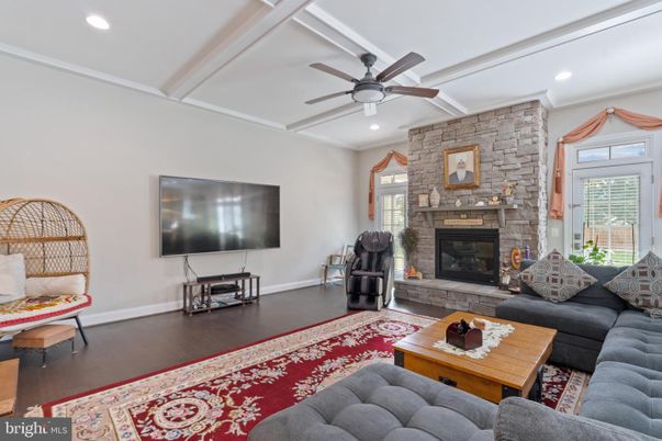 Fireplace, Interior, Living room, Recessed Lighting, Stone Walls, Wood Texture Flooring