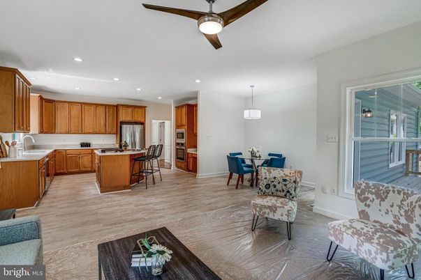 Dining room, Interior, Kitchen, Pendant Lights, Recessed Lighting, Stainless Steel Appliances, Wood Texture Flooring