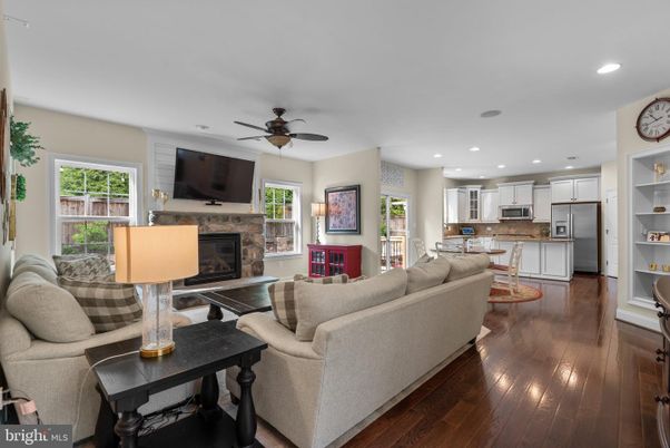 Fireplace, Interior, Kitchen, Living room, Recessed Lighting, Stainless Steel Appliances, Wood Texture Flooring