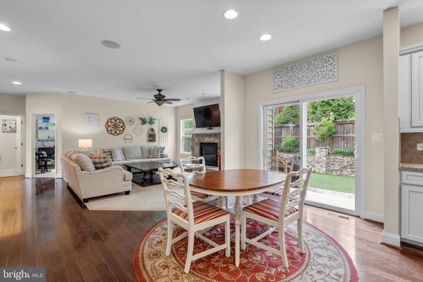 Dining room, Fireplace, Interior, Living room, Recessed Lighting, Wood Texture Flooring