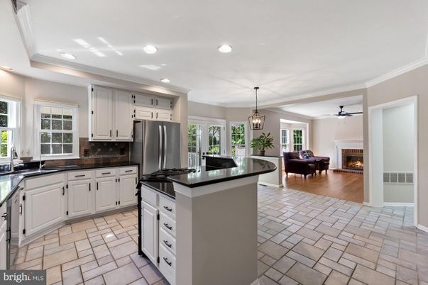 Fireplace, Interior, Kitchen, Living room, Pendant Lights, Recessed Lighting, Stainless Steel Appliances, Wood Texture Flooring