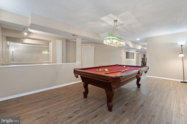 Billiard Table, Chandelier, Game Room, Interior, Pendant Lights, Recessed Lighting, Wood Texture Flooring