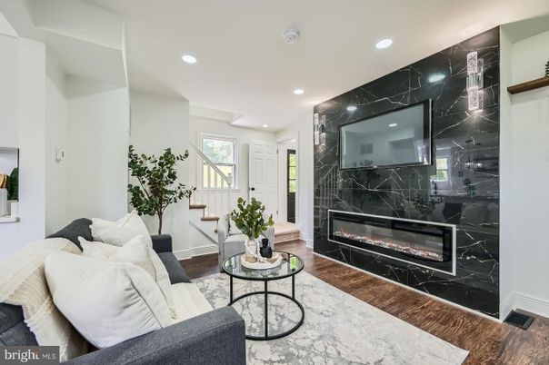 Fireplace, Interior, Living room, Marble Walls, Recessed Lighting, Wood Texture Flooring