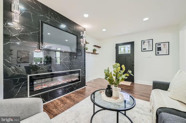Fireplace, Interior, Marble Walls, Recessed Lighting, Wood Texture Flooring