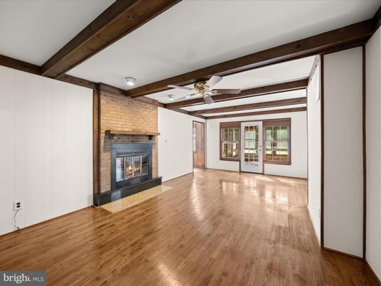 Empty room, Fireplace, Interior, Stone Walls, Wooden Beams, Wood Texture Flooring