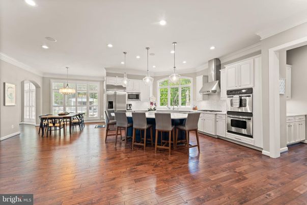 Dining room, Interior, Kitchen, Pendant Lights, Recessed Lighting, Stainless Steel Appliances, Wood Texture Flooring