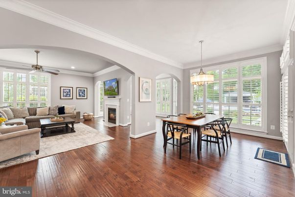 Dining room, Fireplace, Interior, Living room, Pendant Lights, Recessed Lighting, Wood Texture Flooring