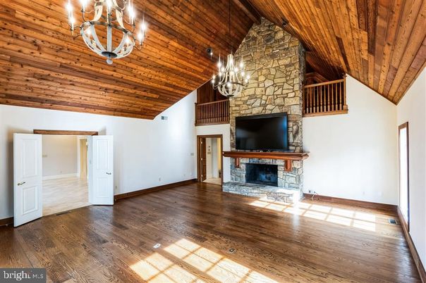 Chandelier, Empty room, Fireplace, Interior, Stone Walls, Wooden Beams, Wooden Ceilings, Wood Texture Flooring