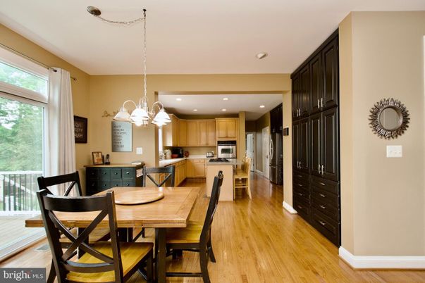 Chandelier, Dining room, Interior, Kitchen, Pendant Lights, Recessed Lighting, Stainless Steel Appliances, Wood Texture Flooring