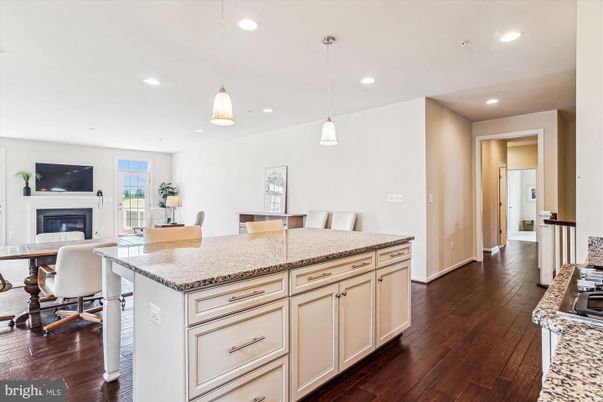 Dining room, Fireplace, Interior, Kitchen, Pendant Lights, Recessed Lighting, Wood Texture Flooring