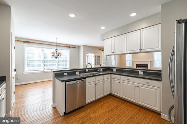 Chandelier, Interior, Kitchen, Recessed Lighting, Stainless Steel Appliances, Wood Texture Flooring