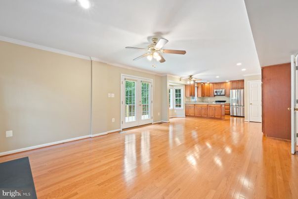 Empty room, Interior, Kitchen, Recessed Lighting, Stainless Steel Appliances, Wood Texture Flooring