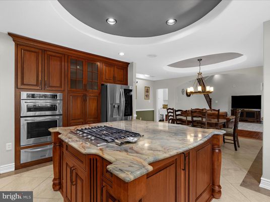Chandelier, Dining room, Fireplace, Interior, Kitchen, Recessed Lighting, Stainless Steel Appliances