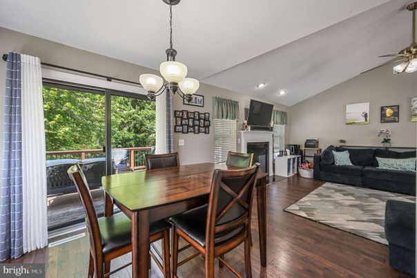 Dining room, Fireplace, Interior, Living room, Pendant Lights, Recessed Lighting, Wood Texture Flooring