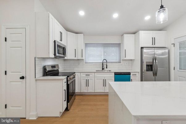 Interior, Kitchen, Recessed Lighting, Stainless Steel Appliances, Wood Texture Flooring