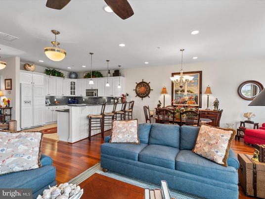 Chandelier, Dining room, Interior, Kitchen, Living room, Pendant Lights, Recessed Lighting, Stainless Steel Appliances, Wood Texture Flooring