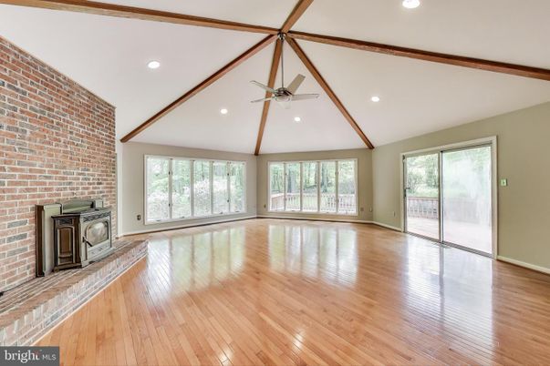 Empty room, Fireplace, Interior, Recessed Lighting, Stone Walls, Wooden Beams, Wood Texture Flooring