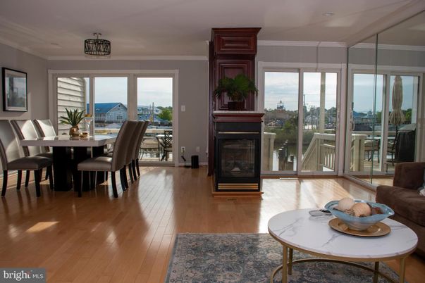 Dining room, Fireplace, Interior, Recessed Lighting, Water, Wood Texture Flooring