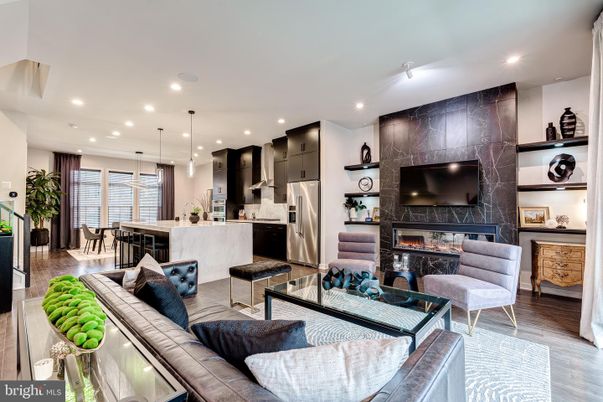 Dining room, Fireplace, Interior, Kitchen, Living room, Pendant Lights, Recessed Lighting, Stainless Steel Appliances, Wood Texture Flooring