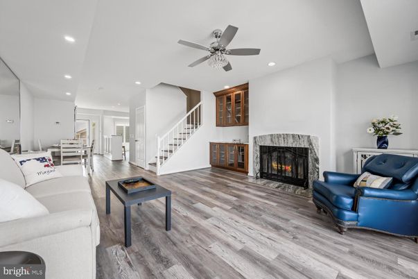 Dining room, Fireplace, Interior, Living room, Recessed Lighting, Wood Texture Flooring
