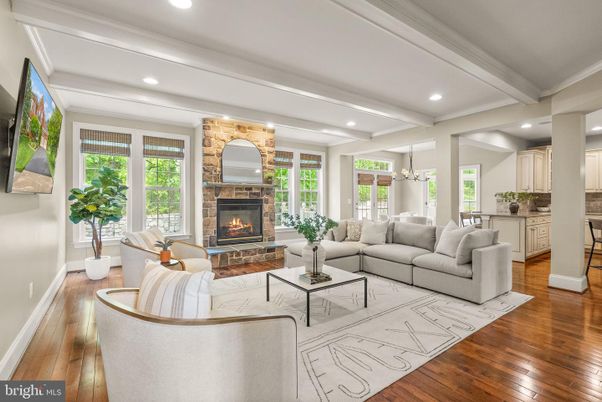 Chandelier, Fireplace, Interior, Living room, Pendant Lights, Recessed Lighting, Stone Walls, Wood Texture Flooring