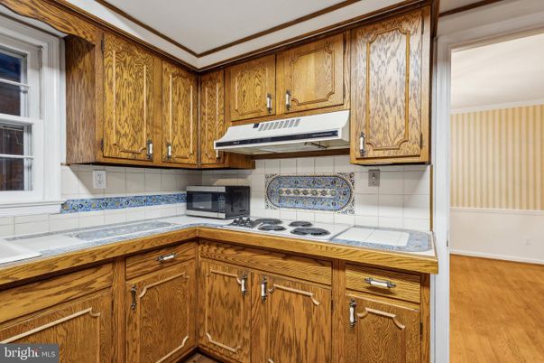 Interior, Kitchen, Tile Countertops, Wood Texture Flooring