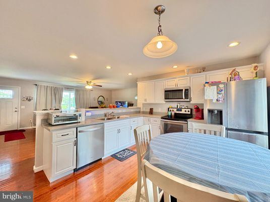Dining room, Interior, Kitchen, Recessed Lighting, Stainless Steel Appliances, Wood Texture Flooring