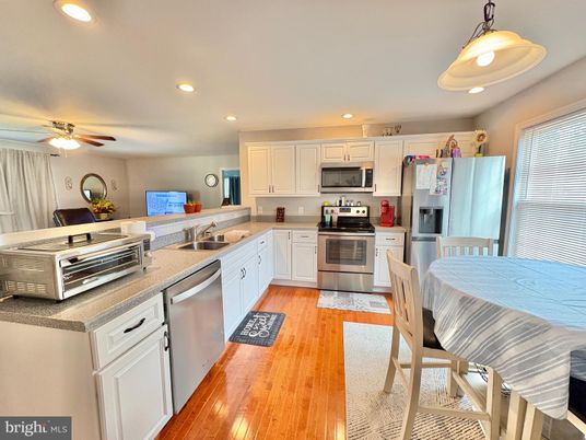 Dining room, Interior, Kitchen, Recessed Lighting, Stainless Steel Appliances, Wood Texture Flooring