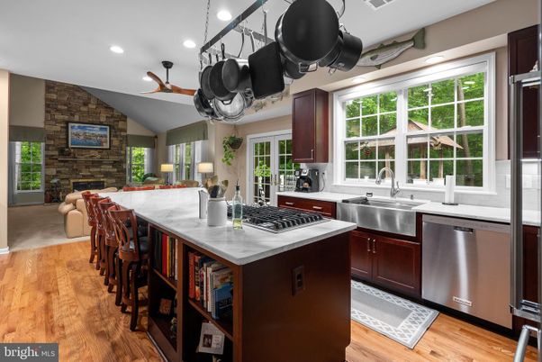 Interior, Kitchen, Recessed Lighting, Stainless Steel Appliances, Stone Walls, Wood Texture Flooring