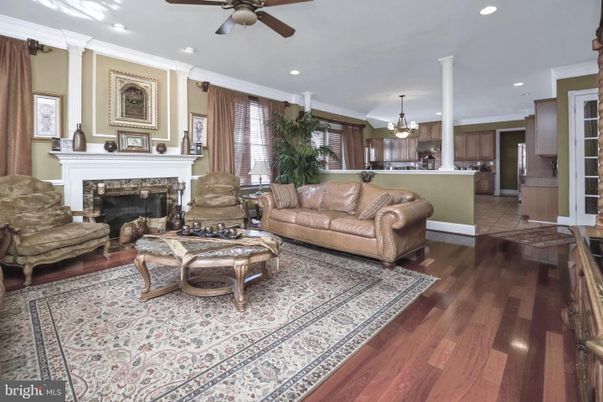 Chandelier, Fireplace, Interior, Kitchen, Living room, Recessed Lighting, Wood Texture Flooring