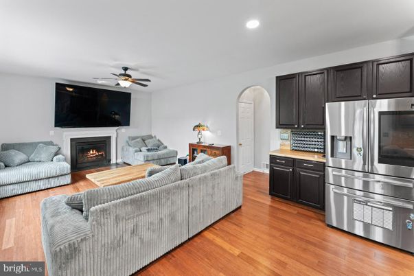 Fireplace, Interior, Kitchen, Living room, Recessed Lighting, Stainless Steel Appliances, Wood Texture Flooring