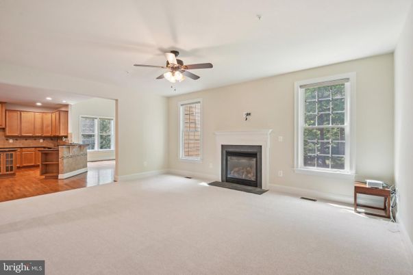 Empty room, Fireplace, Interior, Kitchen, Recessed Lighting, Wood Texture Flooring