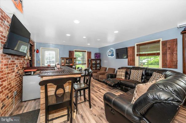Fireplace, Interior, Living room, Recessed Lighting, Stone Walls, Wood Texture Flooring