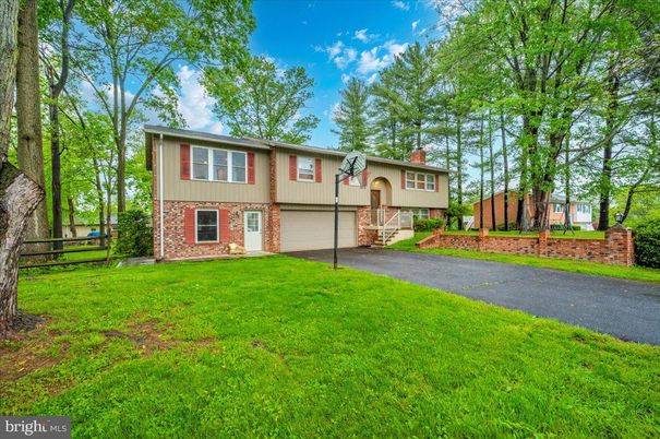 Attached, Backyard, Exterior, Facade, Brick Facade, Raised Ranch