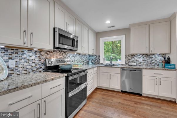 Interior, Kitchen, Recessed Lighting, Stainless Steel Appliances, Wood Texture Flooring