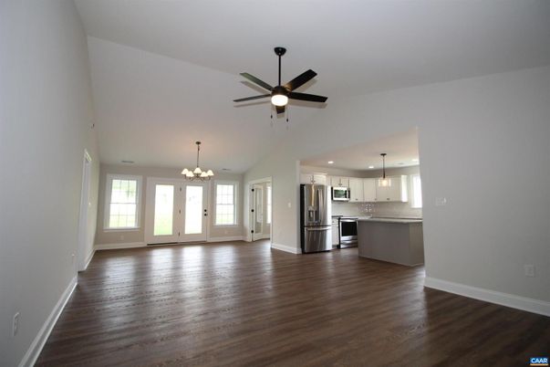 Chandelier, Empty room, Interior, Kitchen, Pendant Lights, Recessed Lighting, Stainless Steel Appliances, Wood Texture Flooring