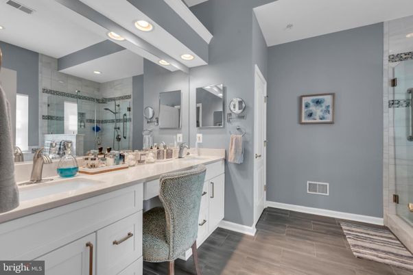 Bathroom, Dual Sink Vanities, Glass Shower, Interior, Recessed Lighting, Wood Texture Flooring