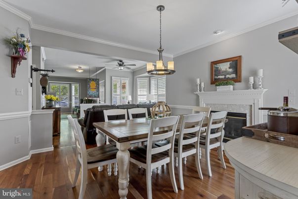 Dining room, Fireplace, Interior, Living room, Pendant Lights, Recessed Lighting, Wood Texture Flooring
