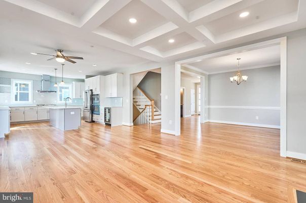 Chandelier, Empty room, Interior, Kitchen, Recessed Lighting, Stainless Steel Appliances, Wood Texture Flooring