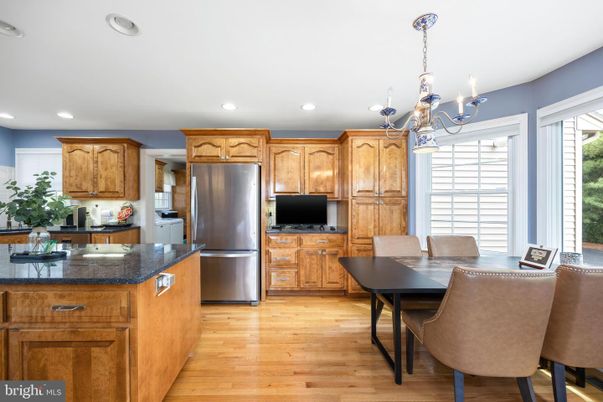 Chandelier, Dining room, Interior, Kitchen, Recessed Lighting, Stainless Steel Appliances, Wood Texture Flooring